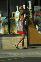 Women up skirt, voyeured near the shop